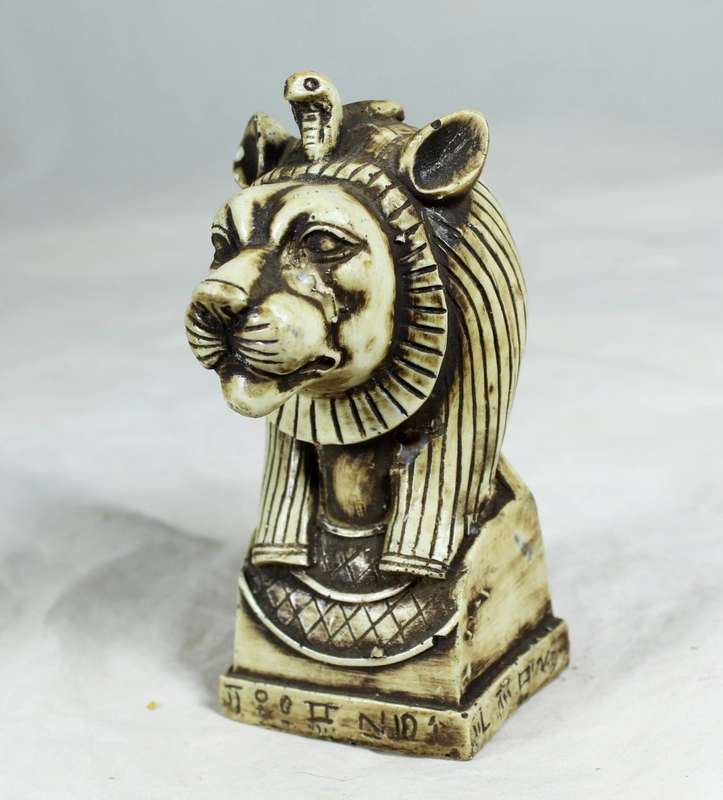 Lion with snake figurine
