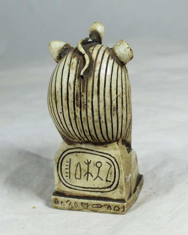 Lion with snake figurine