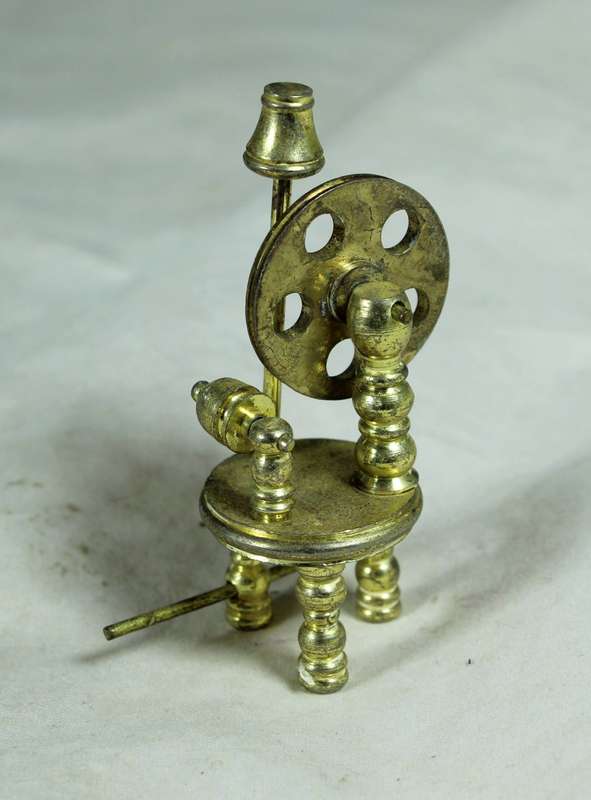 Miniature bronze spinning wheel