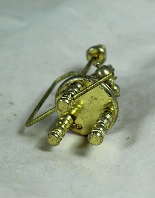 Miniature bronze spinning wheel