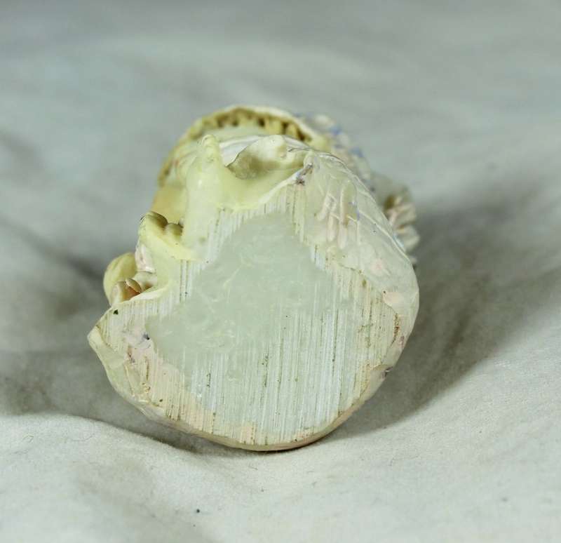 Small seated ceramic baby with bottle