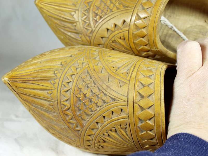 Pair of full size wooden Dutch shoes with carving