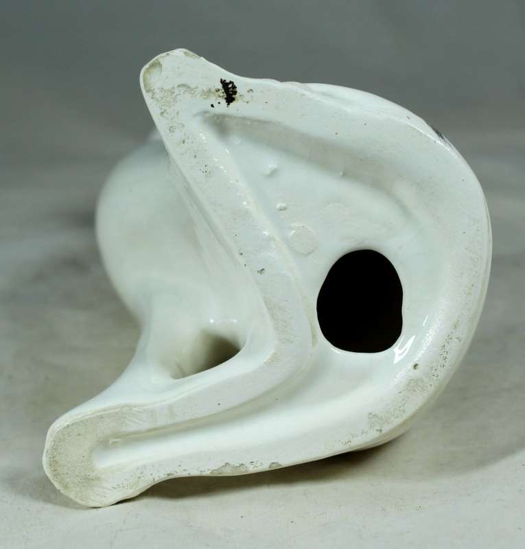Seated slim white cat