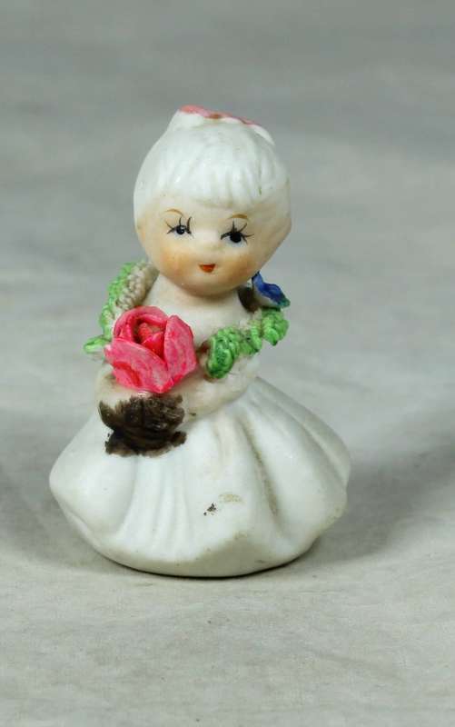 Miniature girl with rose