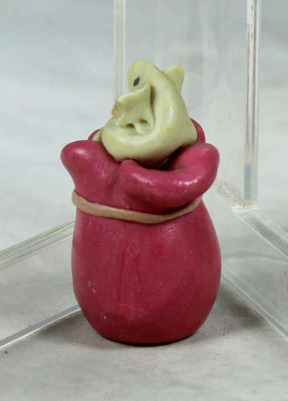 Miniature mouse on a bag