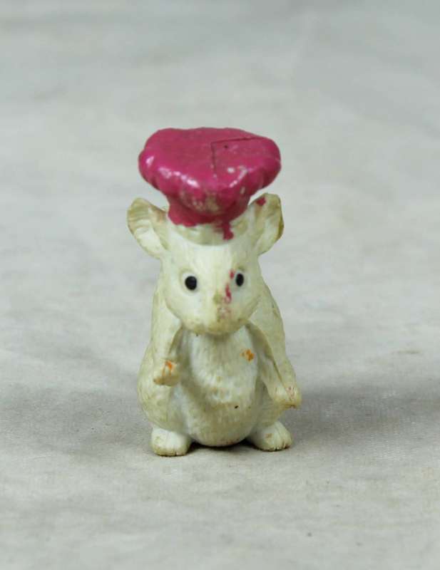 Miniature plastic mouse with a bakers hat