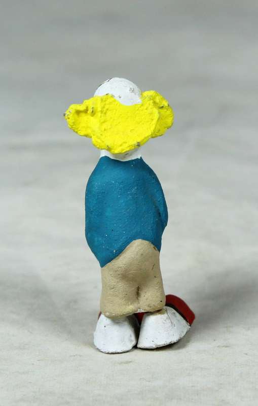 Miniature clown holding a present