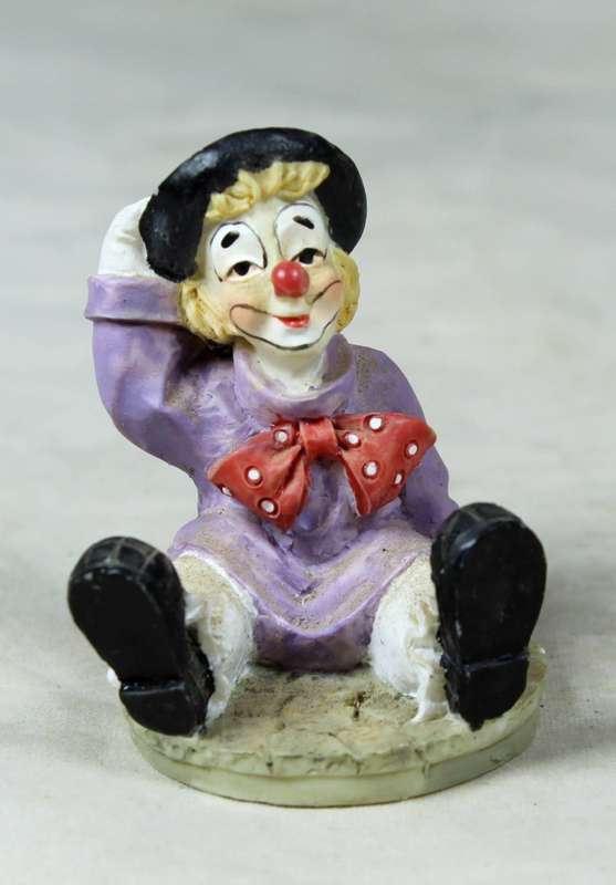 Miniature clown tramp seated