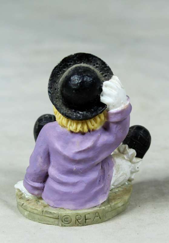 Miniature clown tramp seated