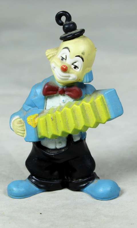 Miniature clown with a concertina and top hat