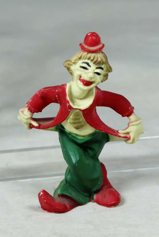 Miniature clown bowing with pointed shoes