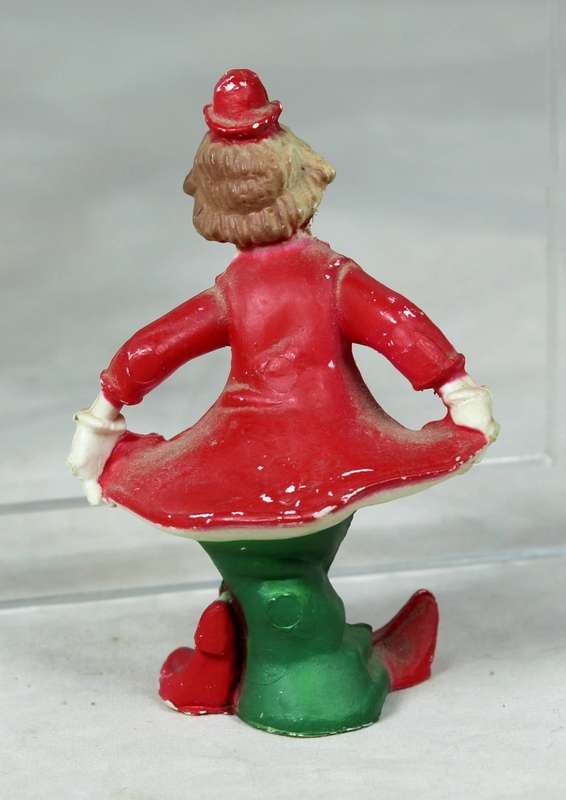 Miniature clown bowing with pointed shoes