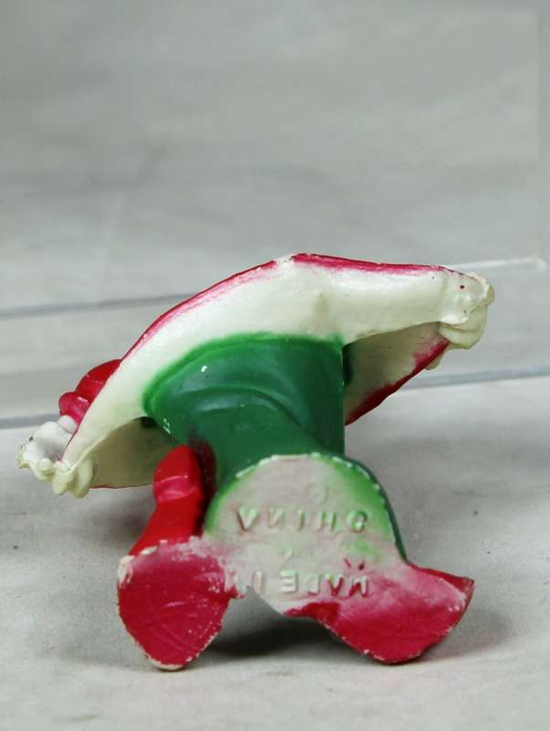 Miniature clown bowing with pointed shoes