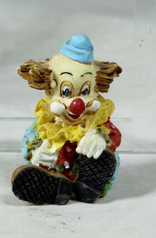 MINIATURE -  A COLOURFULL SEATED CLOWN - BID NOW!!!