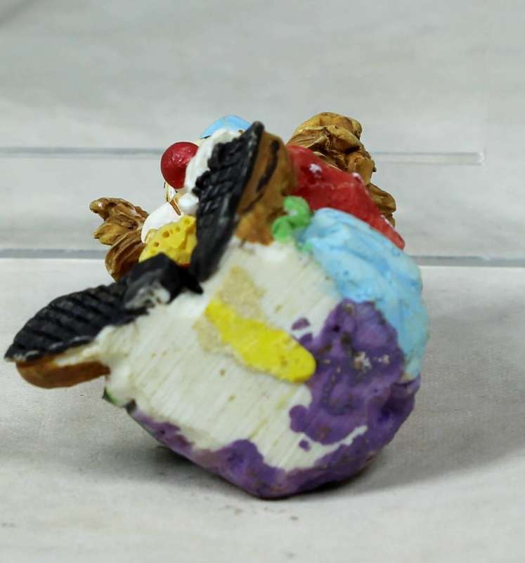 MINIATURE -  A COLOURFULL SEATED CLOWN - BID NOW!!!