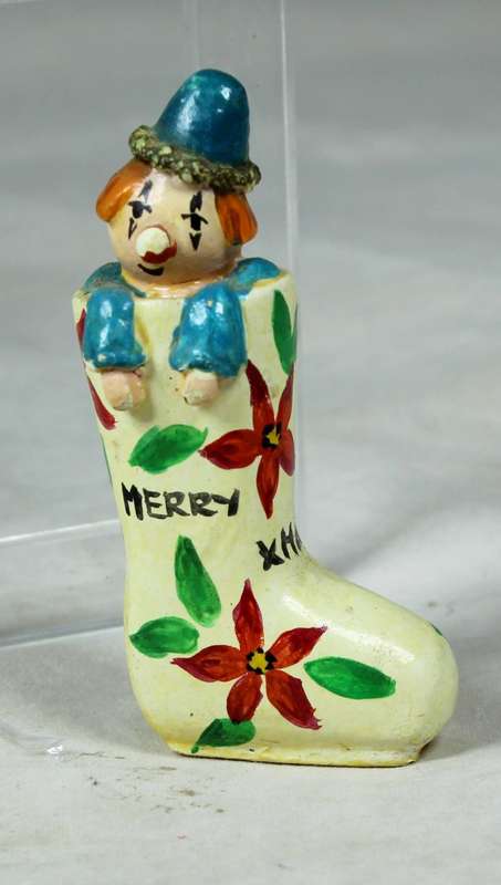 Miniature merry Christmas clown in a shoe