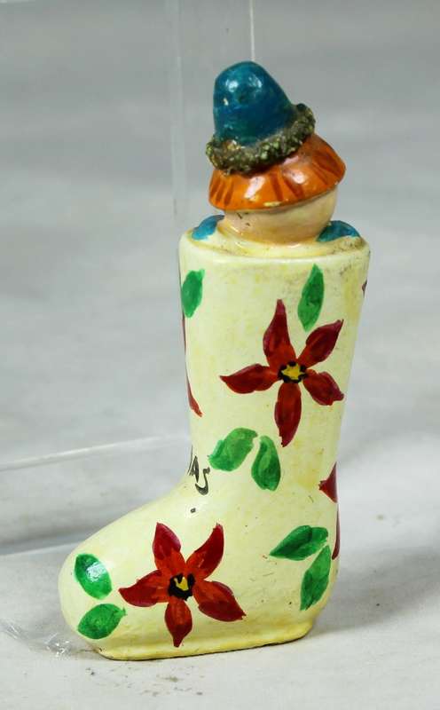 Miniature merry Christmas clown in a shoe