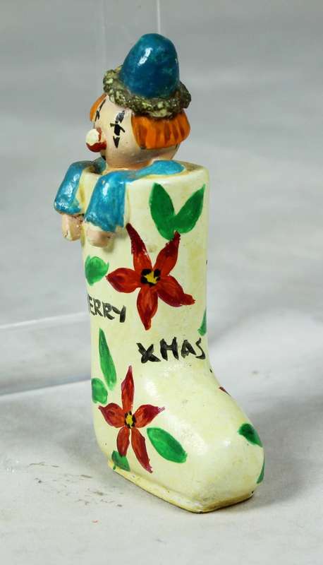 Miniature merry Christmas clown in a shoe