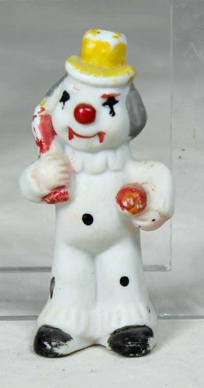 Miniature clown with a yellow top hat