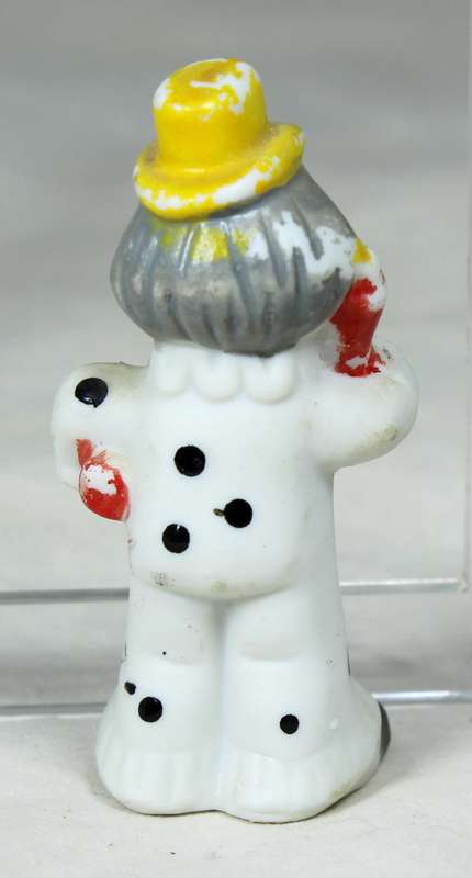 Miniature clown with a yellow top hat
