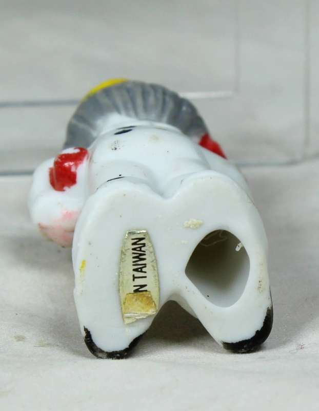 Miniature clown with a yellow top hat