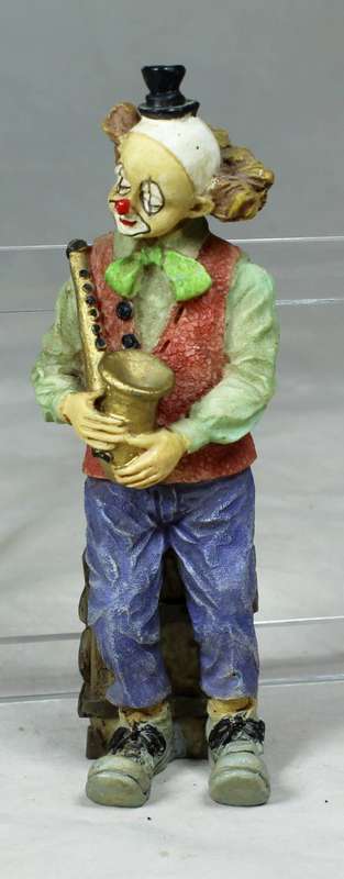 Small clown with a saxophone