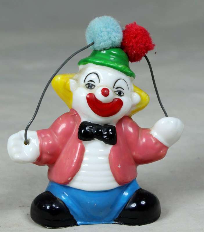 Small clown with fluffy balloons