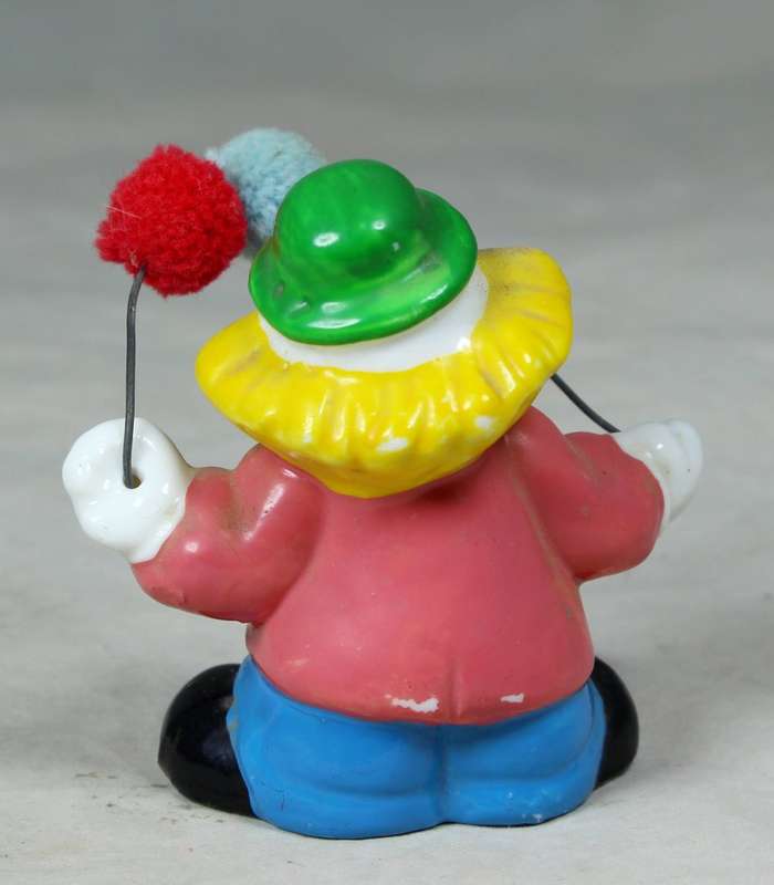 Small clown with fluffy balloons