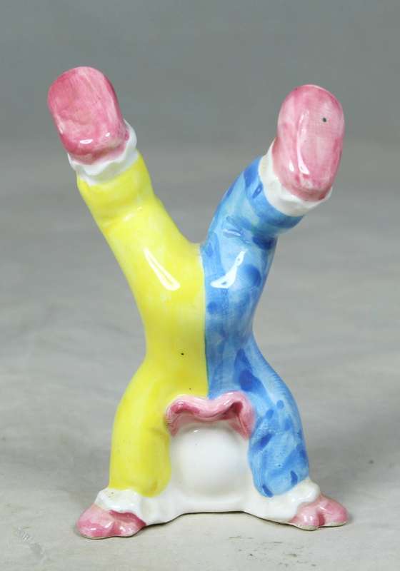 Small clown standing on his head