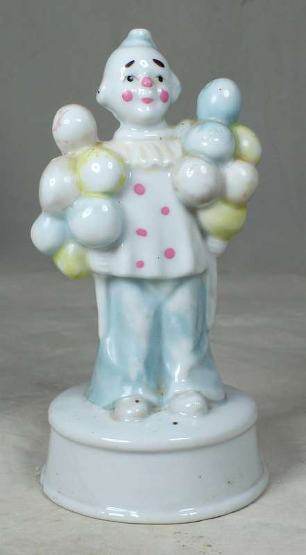A CLOWN WITH MULTI COLOUR BALOONS IN EACH HAND - BID NOW!!!