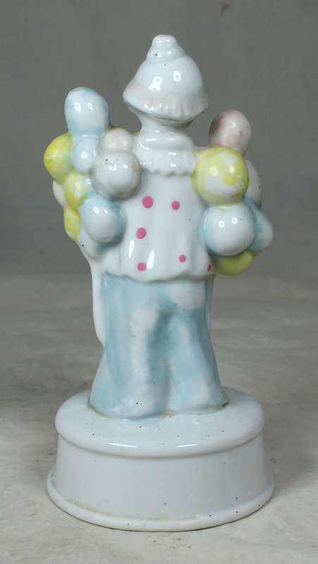 A CLOWN WITH MULTI COLOUR BALOONS IN EACH HAND - BID NOW!!!