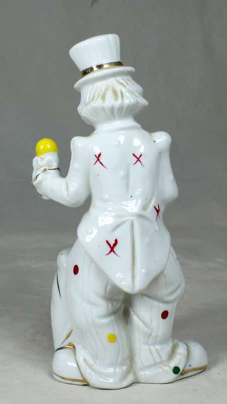 A CLOWN IN A POLKA DOT SUIT PLAYING A DRUM - BID NOW!!!