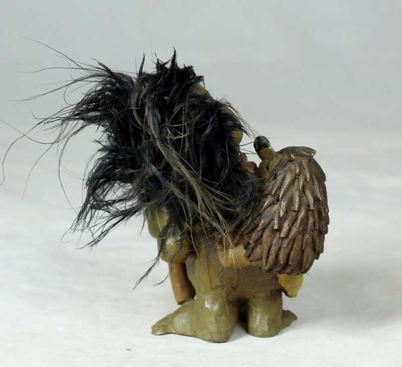 Anthony Fisher - Brownie with a spade and a baby hedgehog on his back