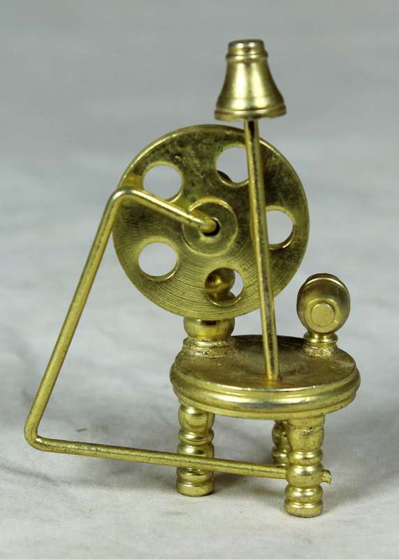 Miniature bronze spinning wheel