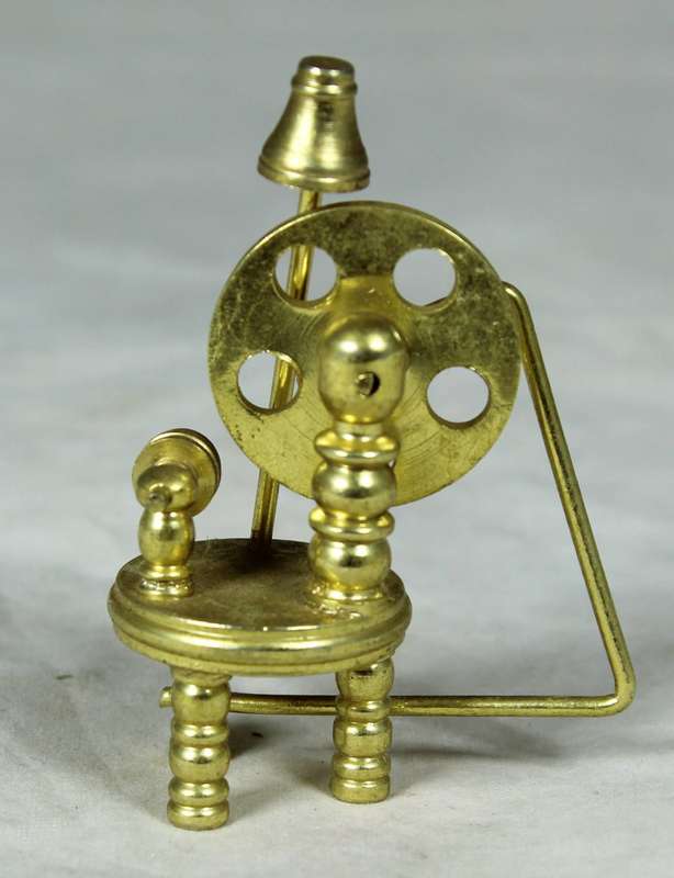 Miniature bronze spinning wheel