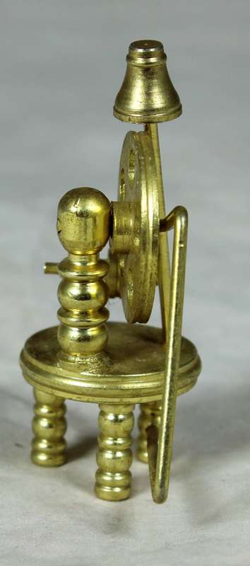 Miniature bronze spinning wheel