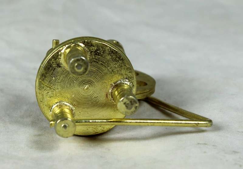 Miniature bronze spinning wheel