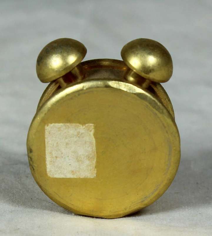 Miniature bronze alarm clock