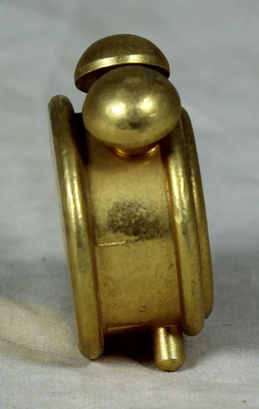 Miniature bronze alarm clock
