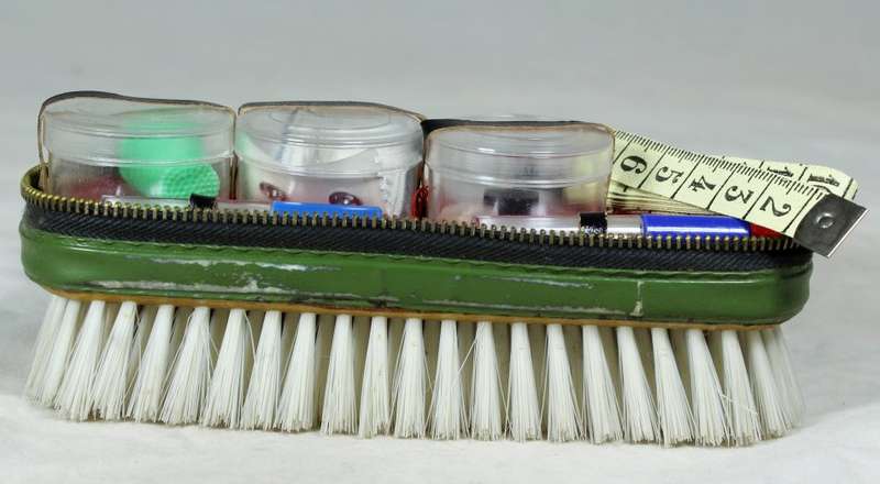Brush with sewing kit