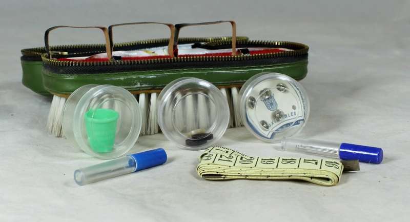 Brush with sewing kit
