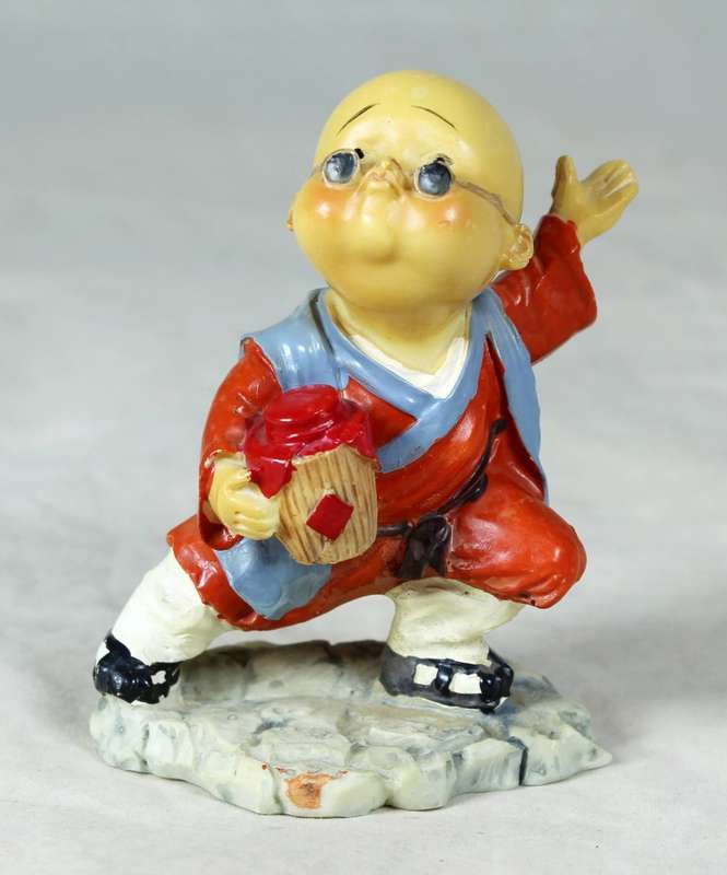 A baby Buddha - Monk striking a pose