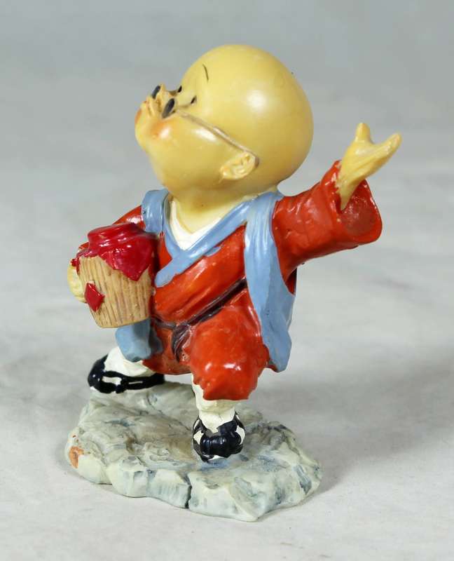 A baby Buddha - Monk striking a pose