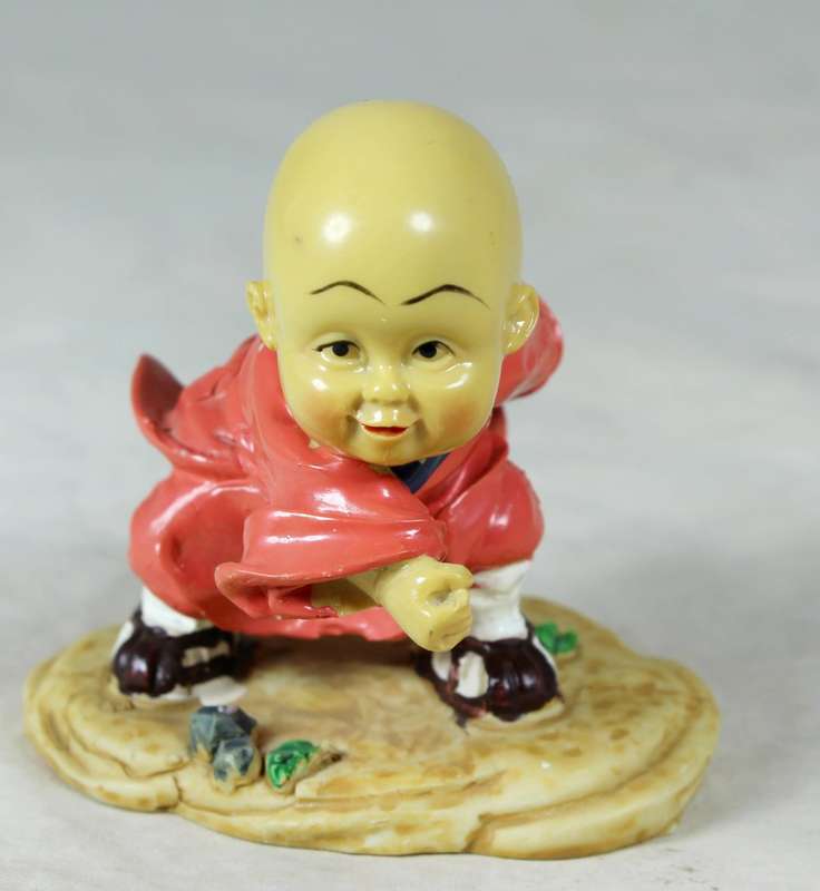 A baby Buddha - Monk practicing martial arts