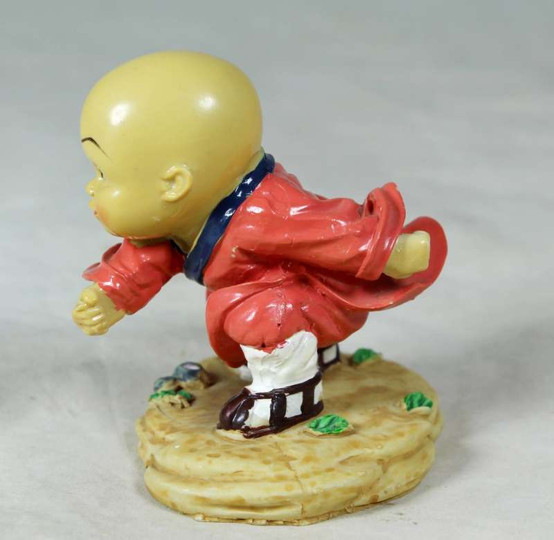A baby Buddha - Monk practicing martial arts