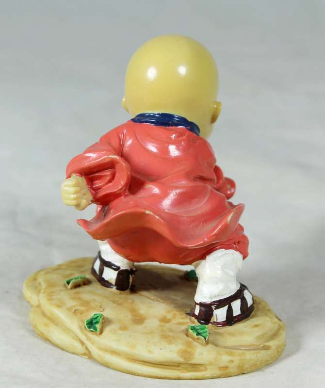 A baby Buddha - Monk practicing martial arts