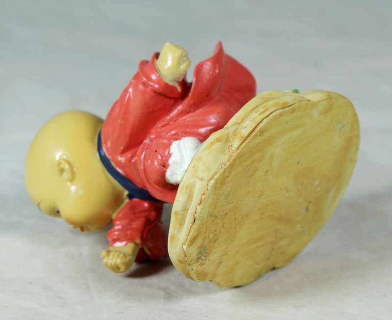 A baby Buddha - Monk practicing martial arts