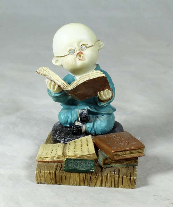 A baby Buddha - Monk reading