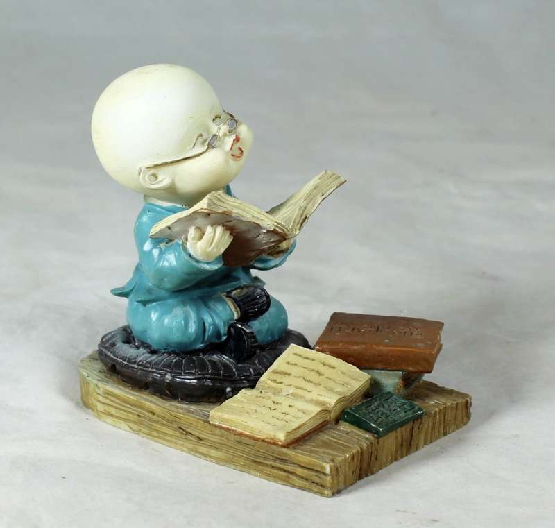 A baby Buddha - Monk reading