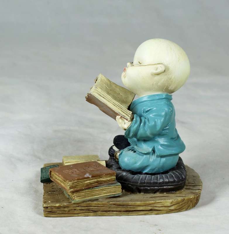 A baby Buddha - Monk reading